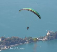 Tandem paragliding over Lake Annecy, chateau de Ruphy